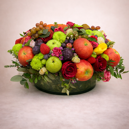 Arrangement of fruits and flowers on a neutral background