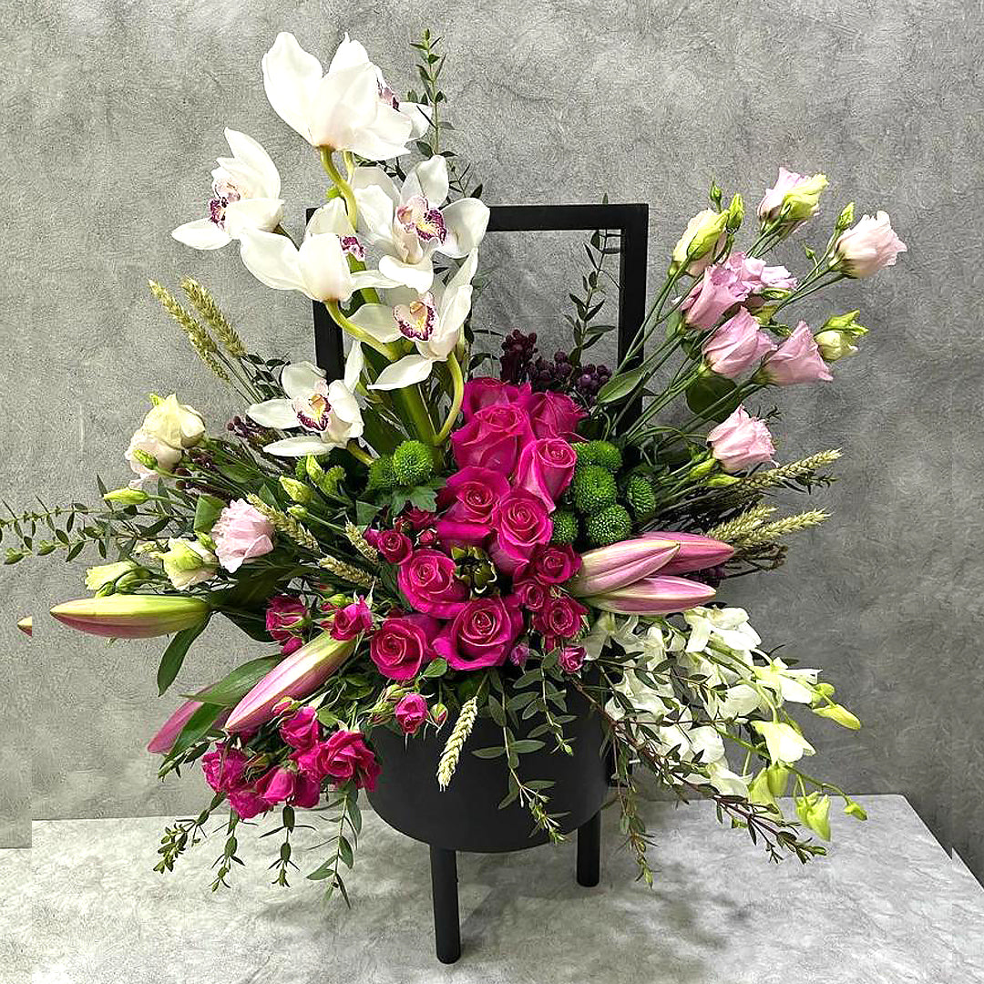 Pink Roses with orchids mix flower arrangement