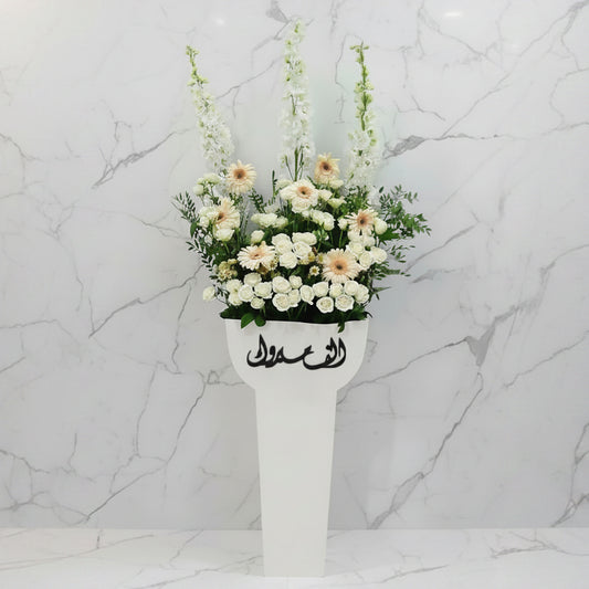 Floral arrangement in a white vase