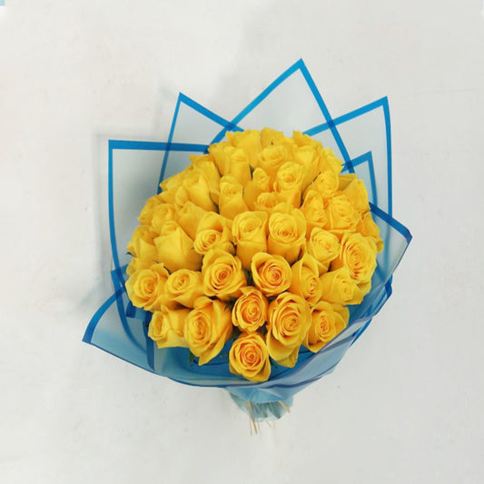 25 Yellow Roses in Elegant Blue Wrapping | Italian Flower Kuwait